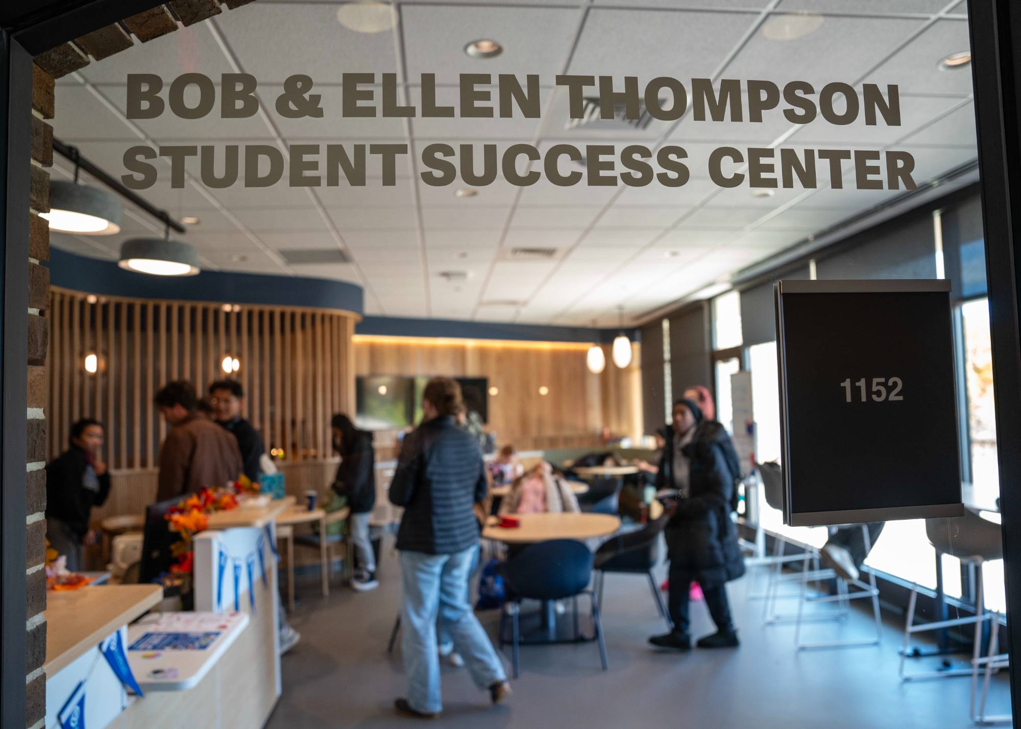 Students and staff standing in the Thompson Student Success Center